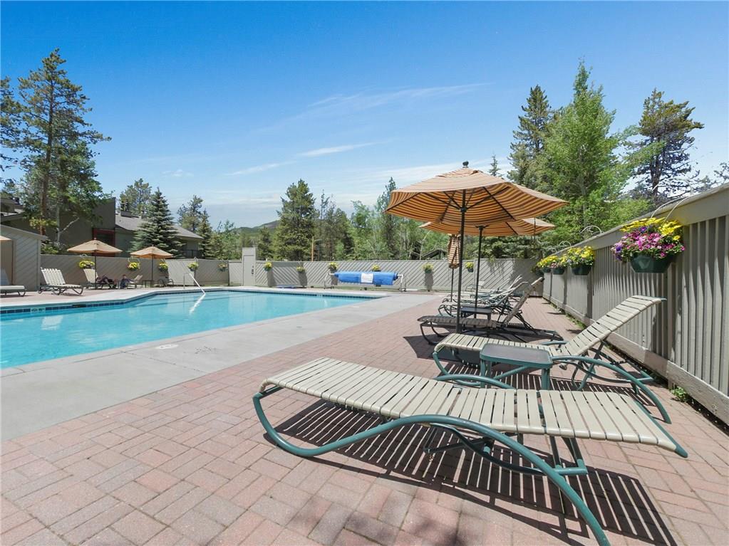 1928 Soda Ridge Road, Unit 1225 Keystone, CO 80435 - Photo 32 of 33 a view of a backyard with sitting area