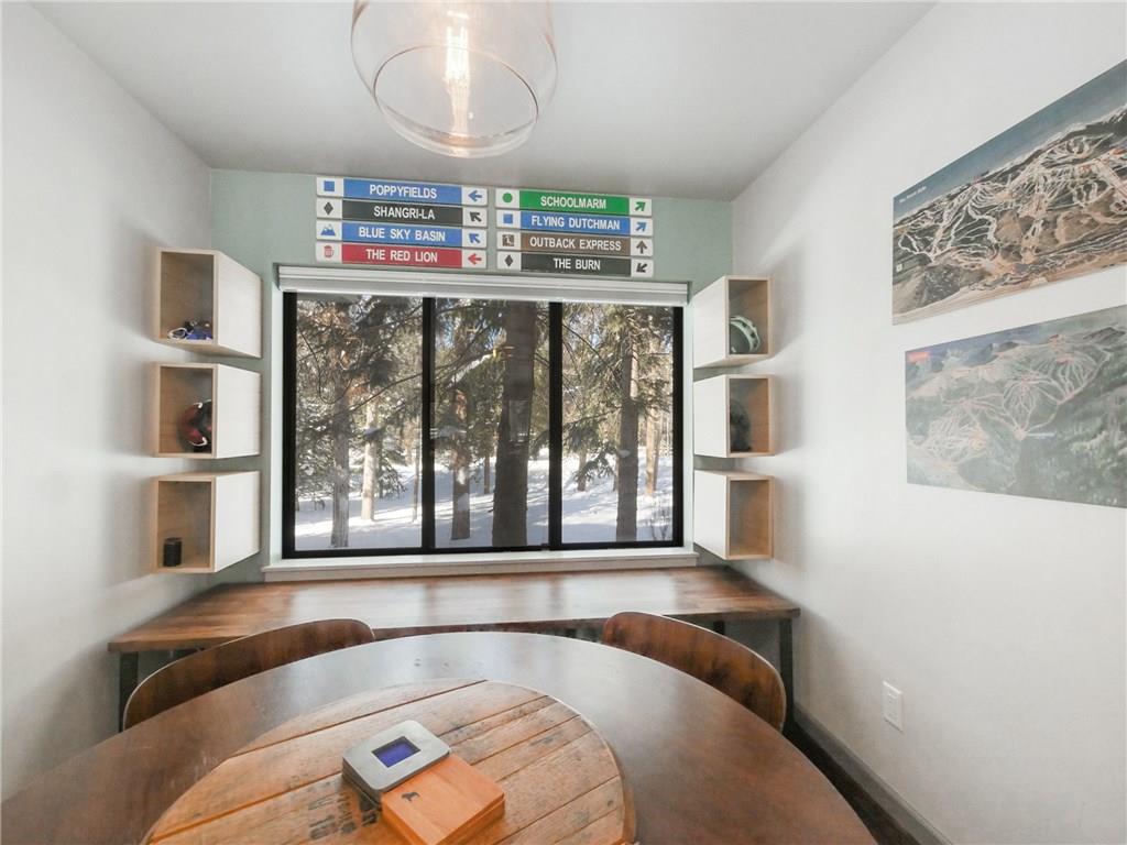 1928 Soda Ridge Road, Unit 1225 Keystone, CO 80435 - Photo 6 of 33 a living room with furniture and a floor to ceiling window