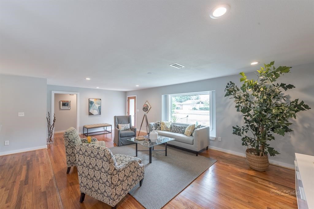 10058 Larston Street Houston, TX 77055 - Photo 6 of 18 a living room with furniture and a potted plant