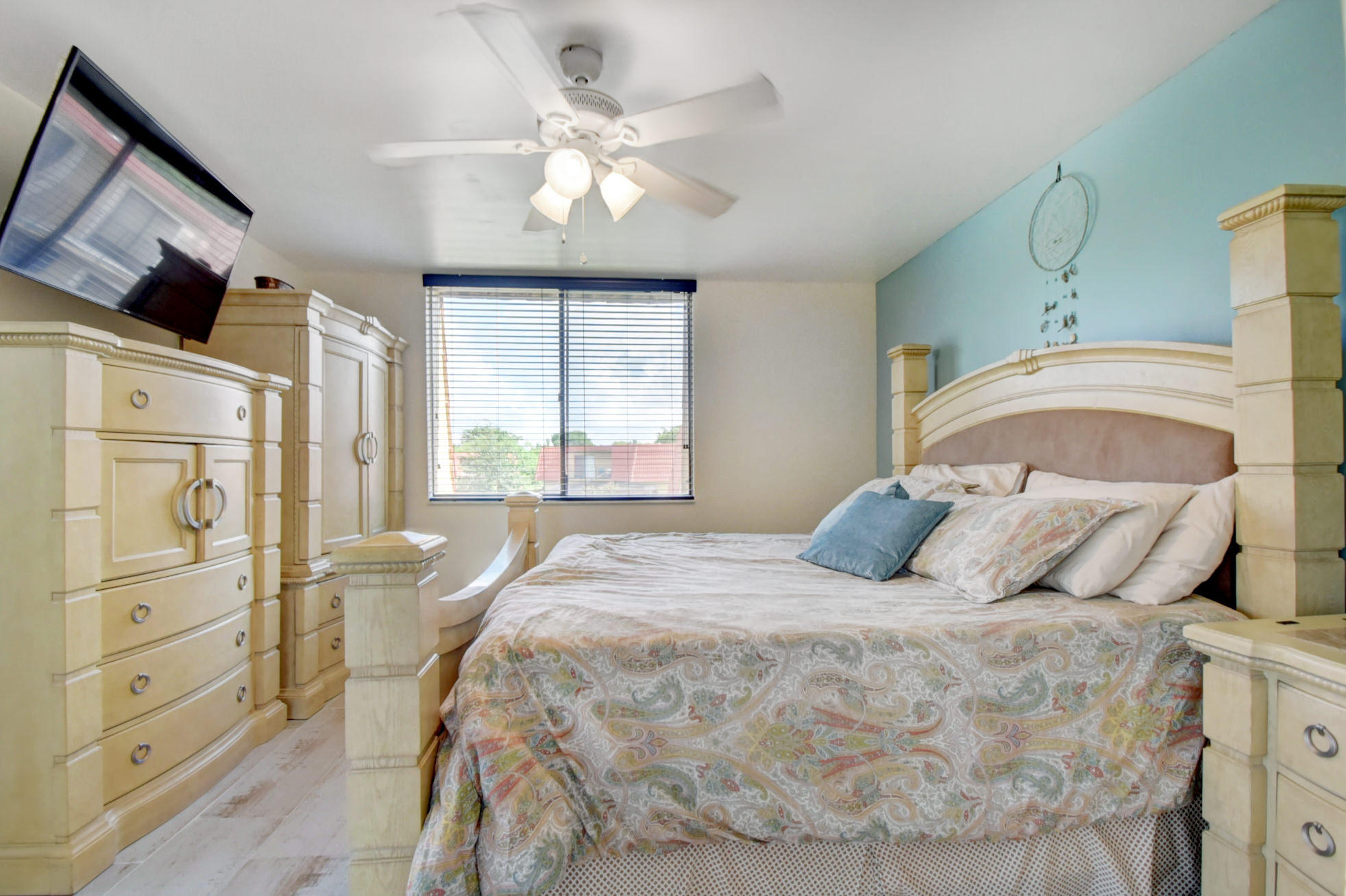 23048 Oxford Place, Unit A Boca Raton, FL 33433 - Photo 12 of 18 a bedroom with a large bed and a window