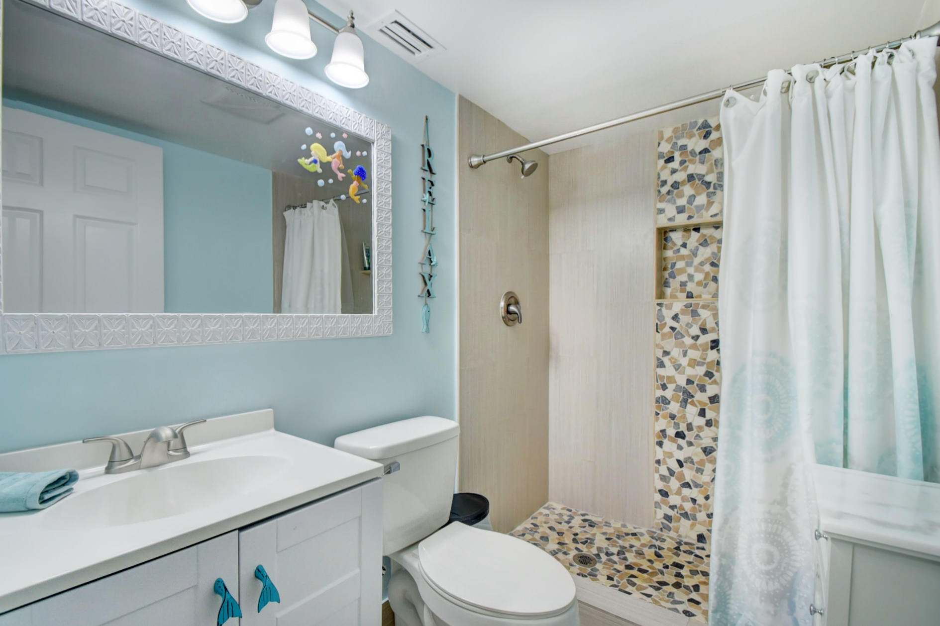 23048 Oxford Place, Unit A Boca Raton, FL 33433 - Photo 14 of 18 a bathroom with a sink toilet and shower