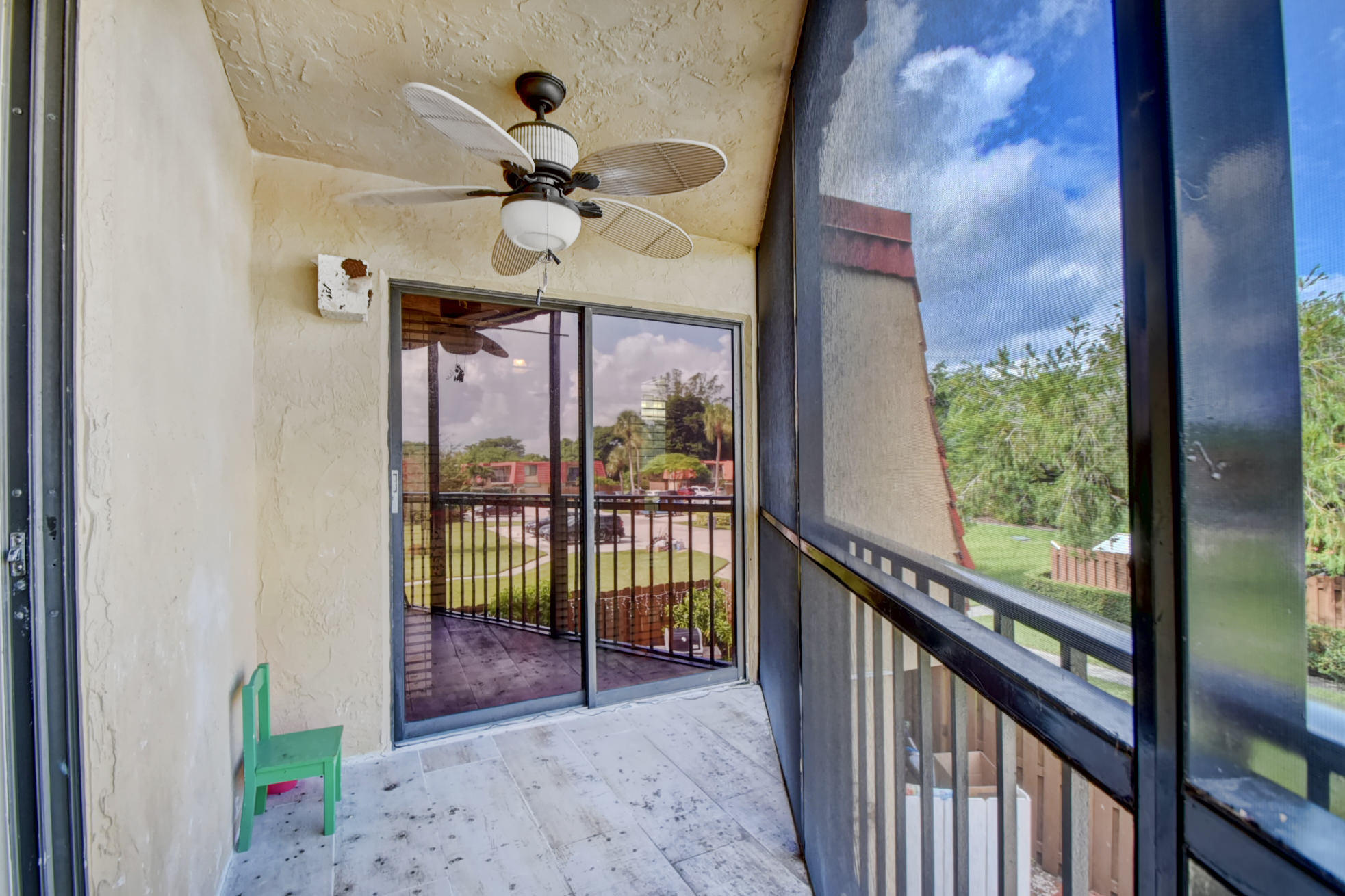 23048 Oxford Place, Unit A Boca Raton, FL 33433 - Photo 15 of 18 a view of a porch with a floor to ceiling window