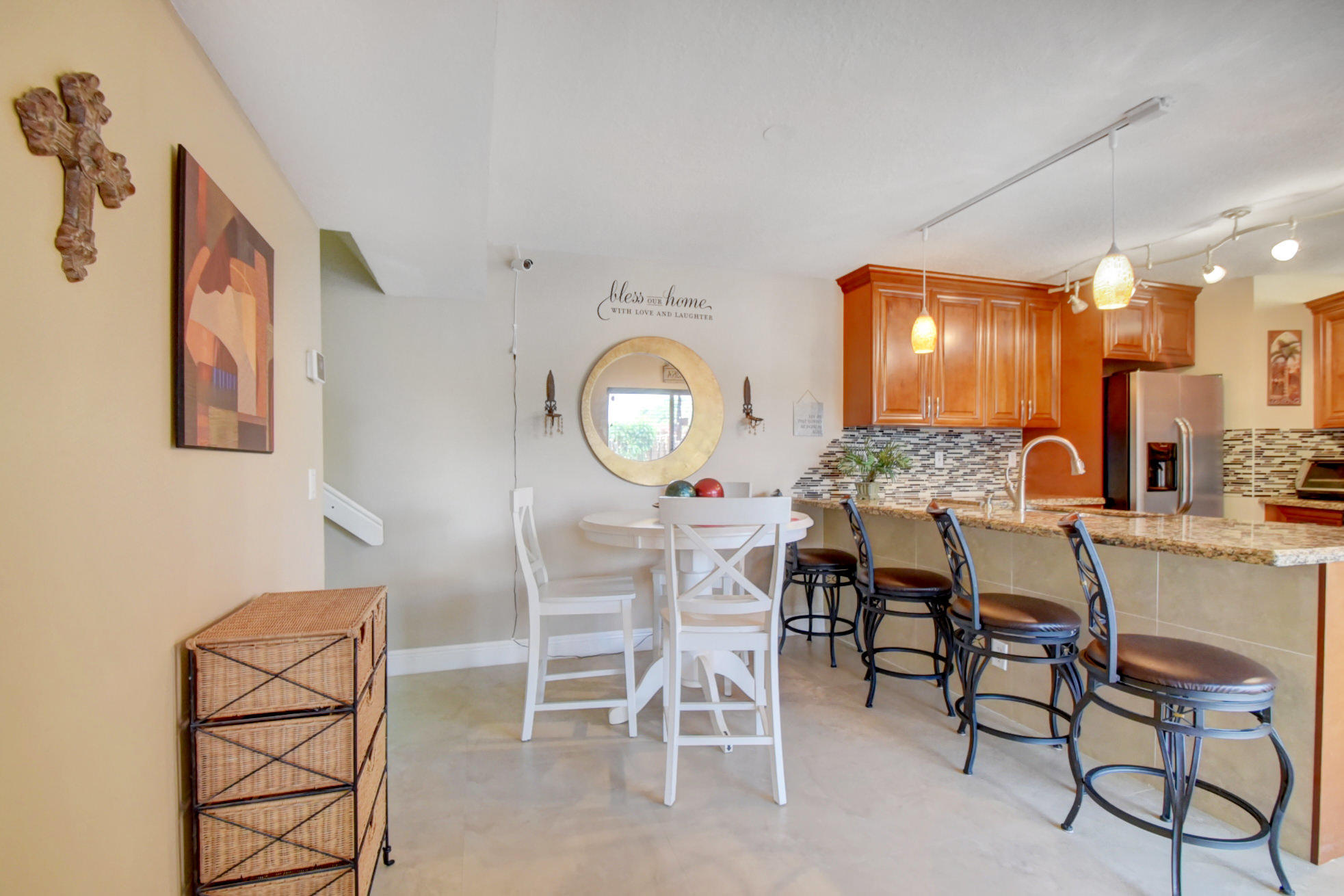 23048 Oxford Place, Unit A Boca Raton, FL 33433 - Photo 6 of 18 a view of a dining room that has a table and chairs in it