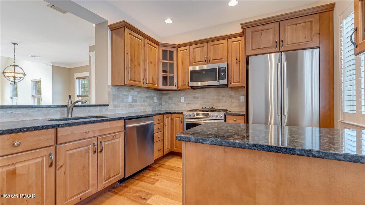 1010 MacIntosh Way Matamoras, PA 18336 - Photo 5 of 60 a kitchen with stainless steel appliances granite countertop a refrigerator and a sink