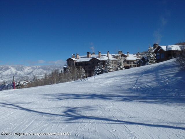 425 Wood Run Road, Unit 36 Snowmass Village, CO 81615 - Photo 23 of 23 a view of a dry yard with wooden fence