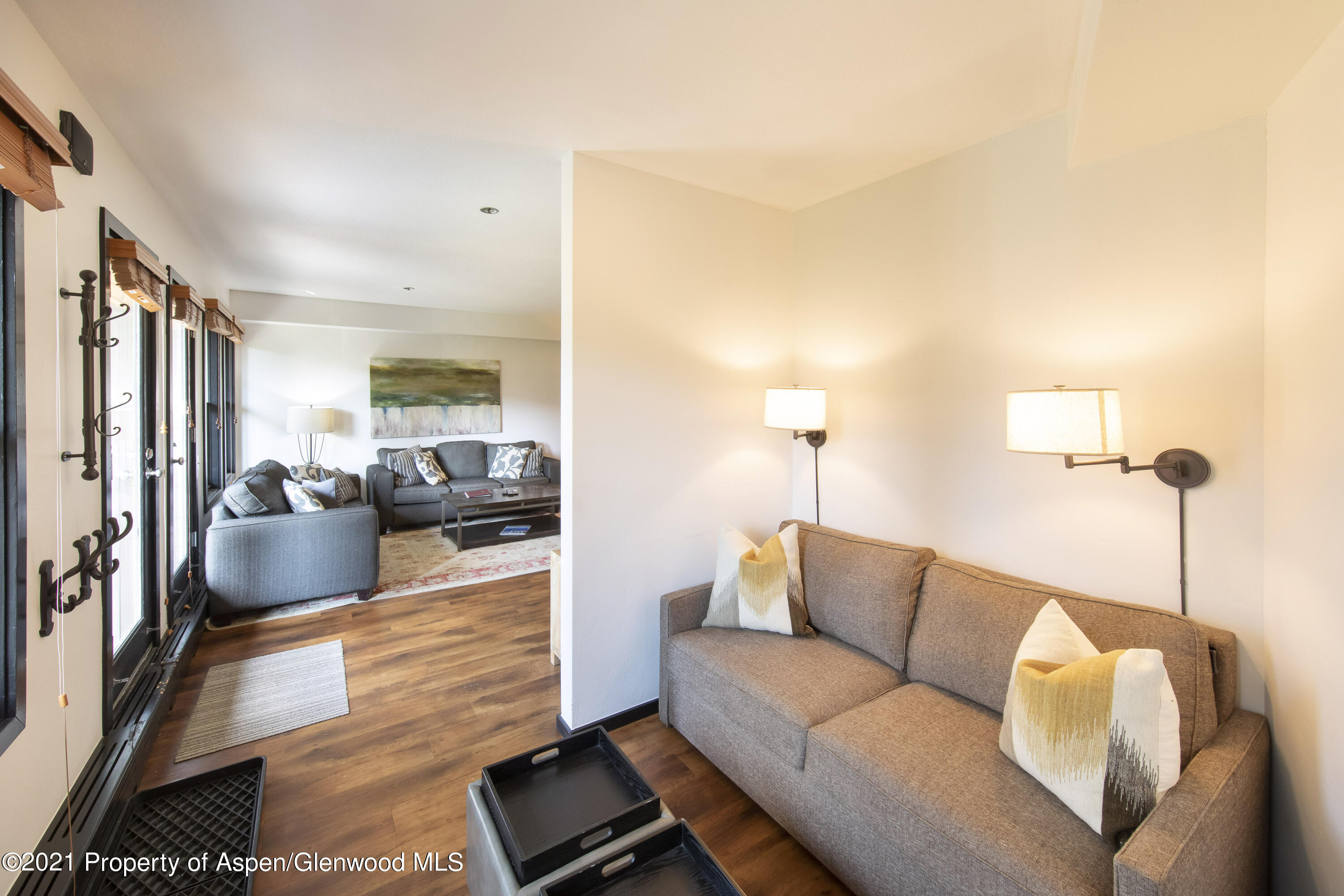 425 Wood Run Road, Unit 36 Snowmass Village, CO 81615 - Photo 6 of 23 a living room with furniture and a wooden floor
