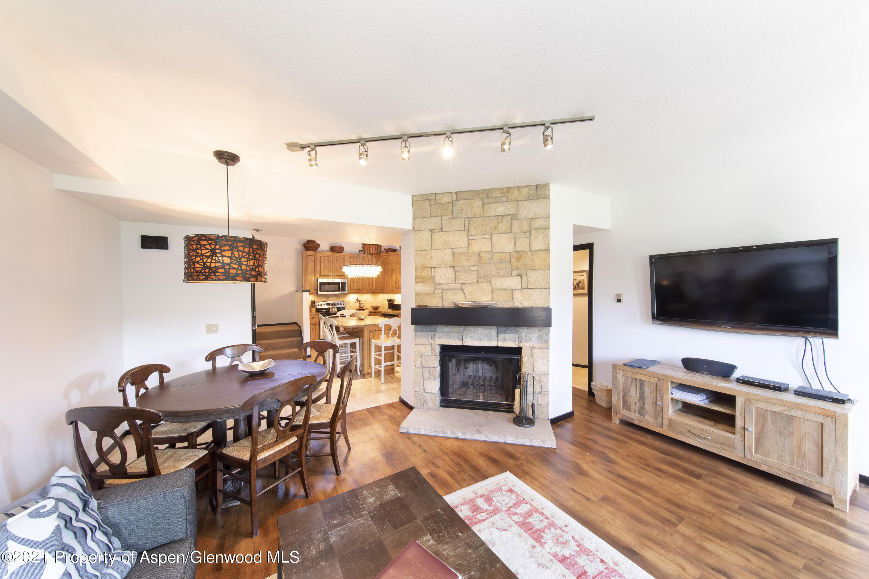 425 Wood Run Road, Unit 36 Snowmass Village, CO 81615 - Photo 7 of 23 a living room with furniture and a flat screen tv