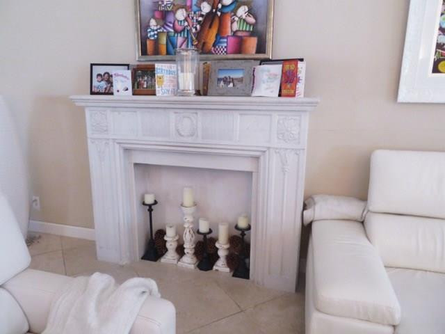 540 Bay Point Road Miami, FL 33137 - Photo 32 of 42 a living room with furniture and a fireplace