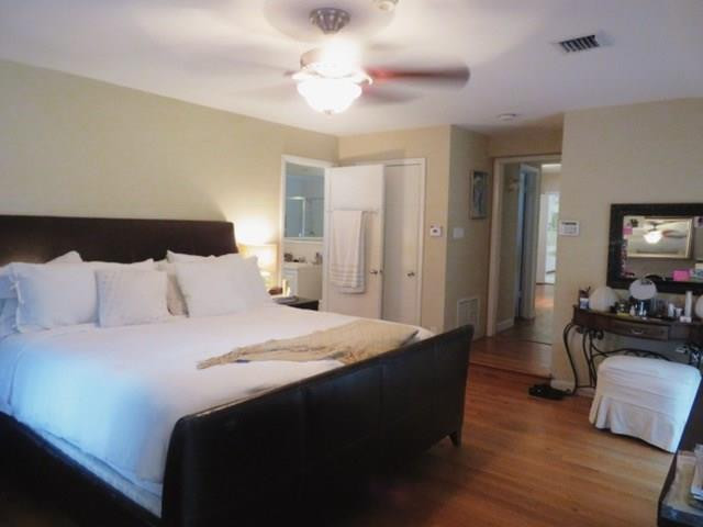 540 Bay Point Road Miami, FL 33137 - Photo 40 of 42 a bedroom with bed and wooden floor