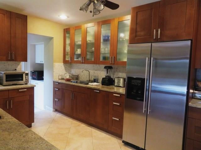 540 Bay Point Road Miami, FL 33137 - Photo 6 of 42 a kitchen with stainless steel appliances granite countertop a refrigerator a sink and a stove