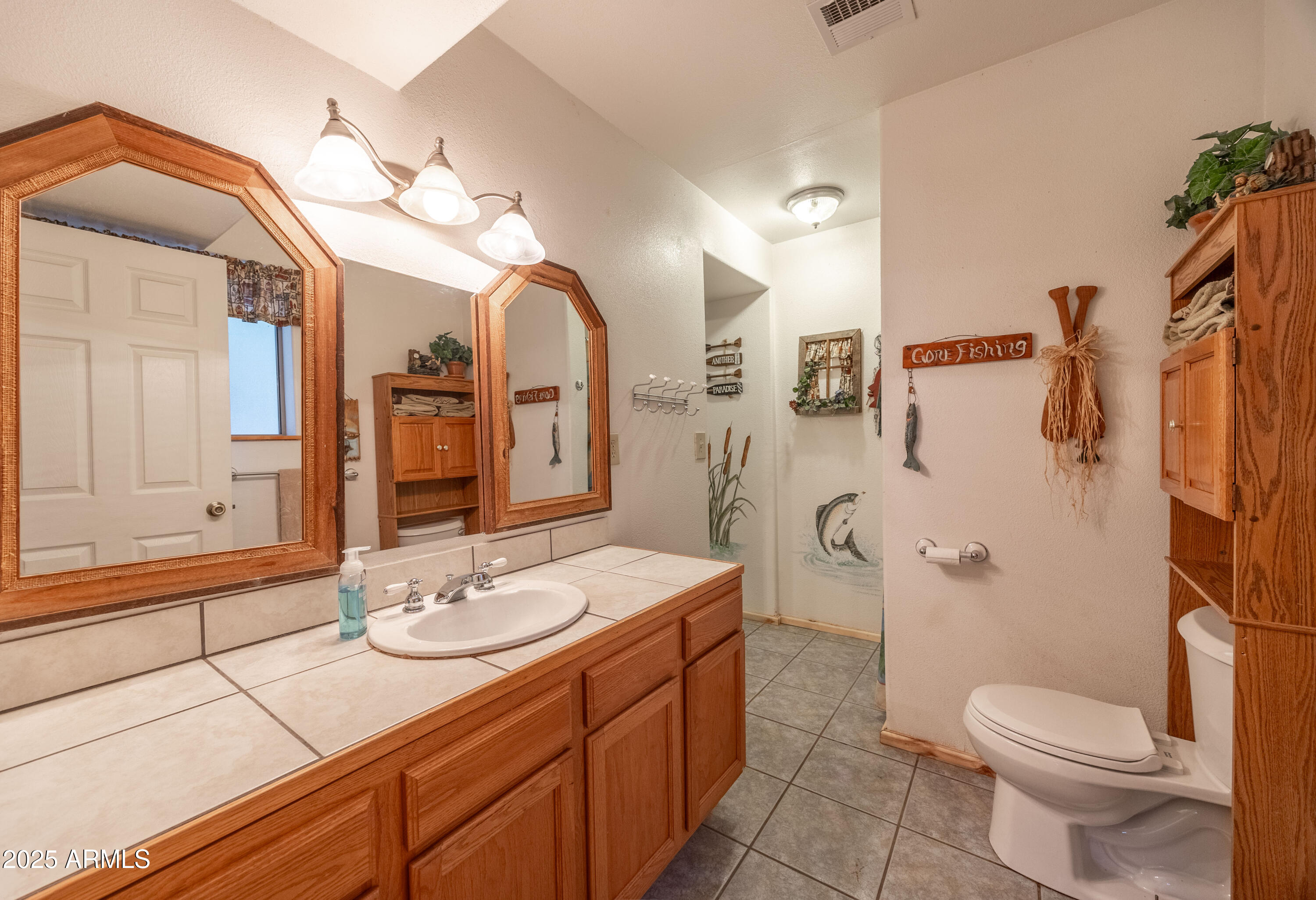 1643 Rifle Way Forest Lakes, AZ 85931 - Photo 10 of 40 a bathroom with a sink a toilet and shower