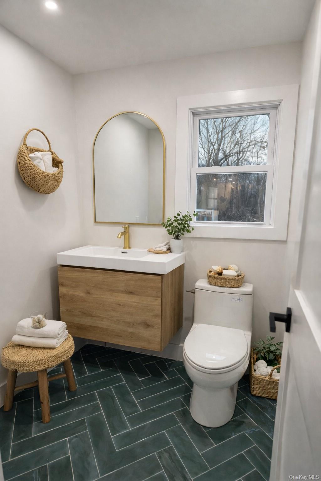 94 Sally Lane Ridge, NY 11961 - Photo 15 of 17 a bathroom with a toilet sink and mirror