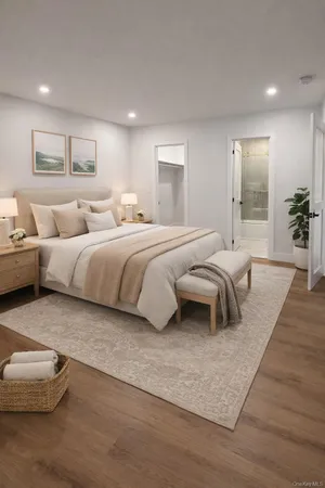 a bedroom with a bed and a couch