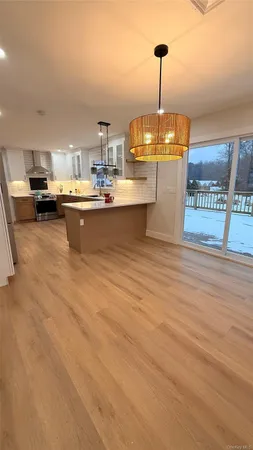 a kitchen with sink and window