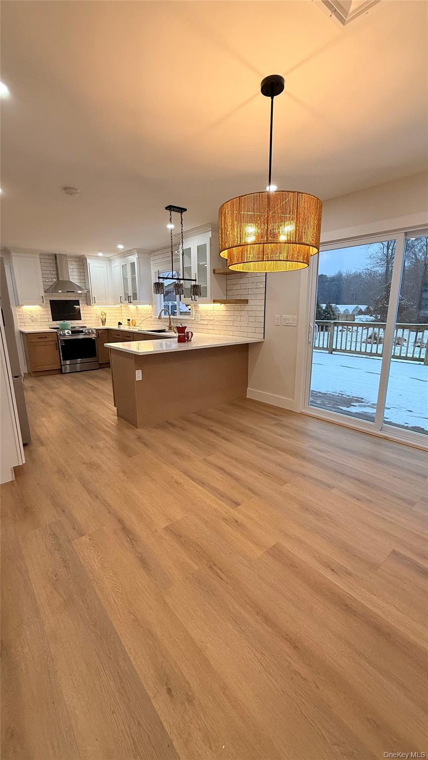 94 Sally Lane Ridge, NY 11961 - Photo 10 of 17 a kitchen with sink and window
