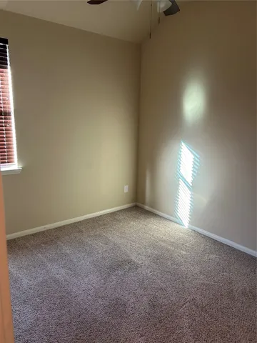 an empty room that has a window