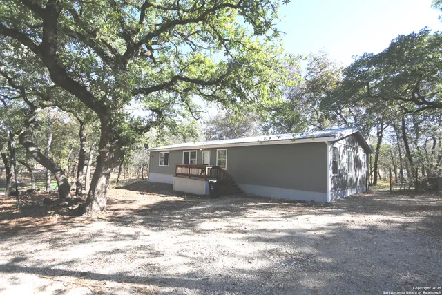 a view of a house with a snow in the yard