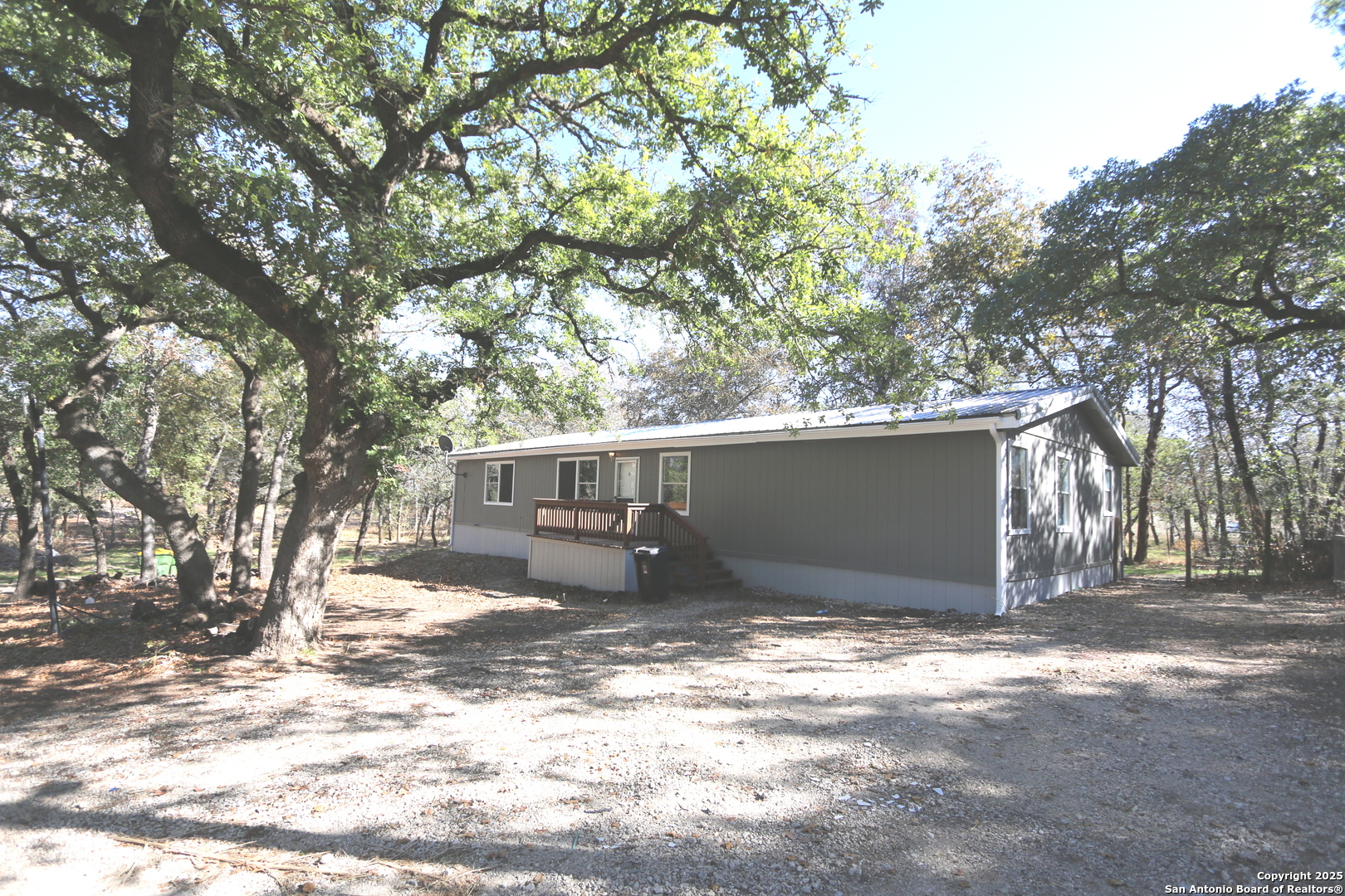 a view of a house with a snow in the yard