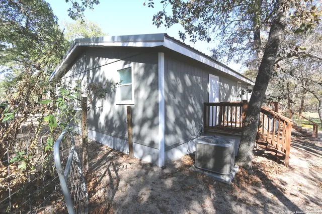 a view of a wooden door of the house