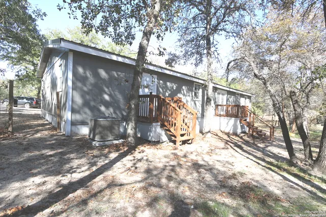a view of a house with a snow in the yard