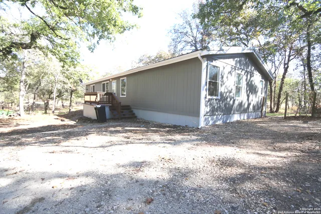 a view of backyard with trees