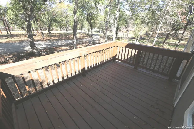 a view of wooden balcony with outdoor space