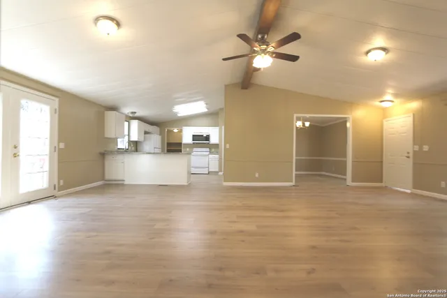 a view of a kitchen with a sink and a window