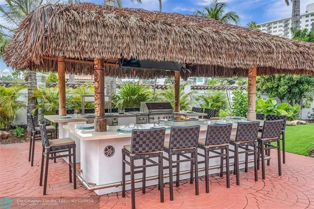 a large swimming pool with outdoor seating and yard