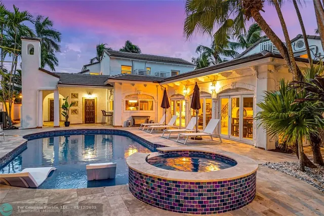 a view of a swimming pool with a patio