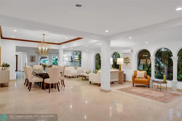 a living room with lots of furniture and clutter