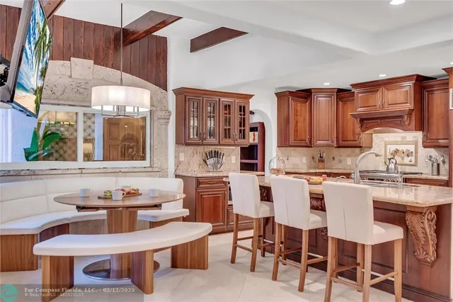 a living room with furniture garden and large windows
