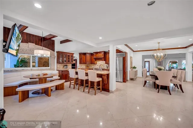 a kitchen with stainless steel appliances granite countertop sink stove top oven and cabinets