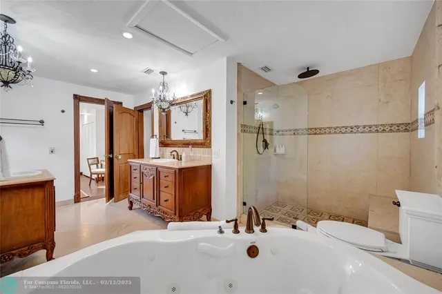 a bedroom with a bed and a dresser with mirror