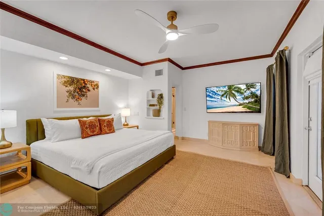 a bedroom with a large bed and a window