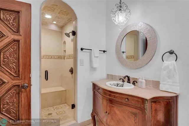 a green field with lots of trees in front of it