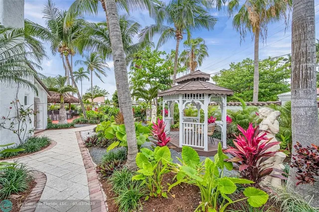 a sign that is sitting in front of a house
