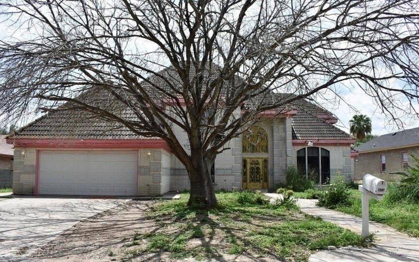 915 Durango Street Mission, TX 78572 - Photo 1 of 1 front view of a house with a yard and an trees