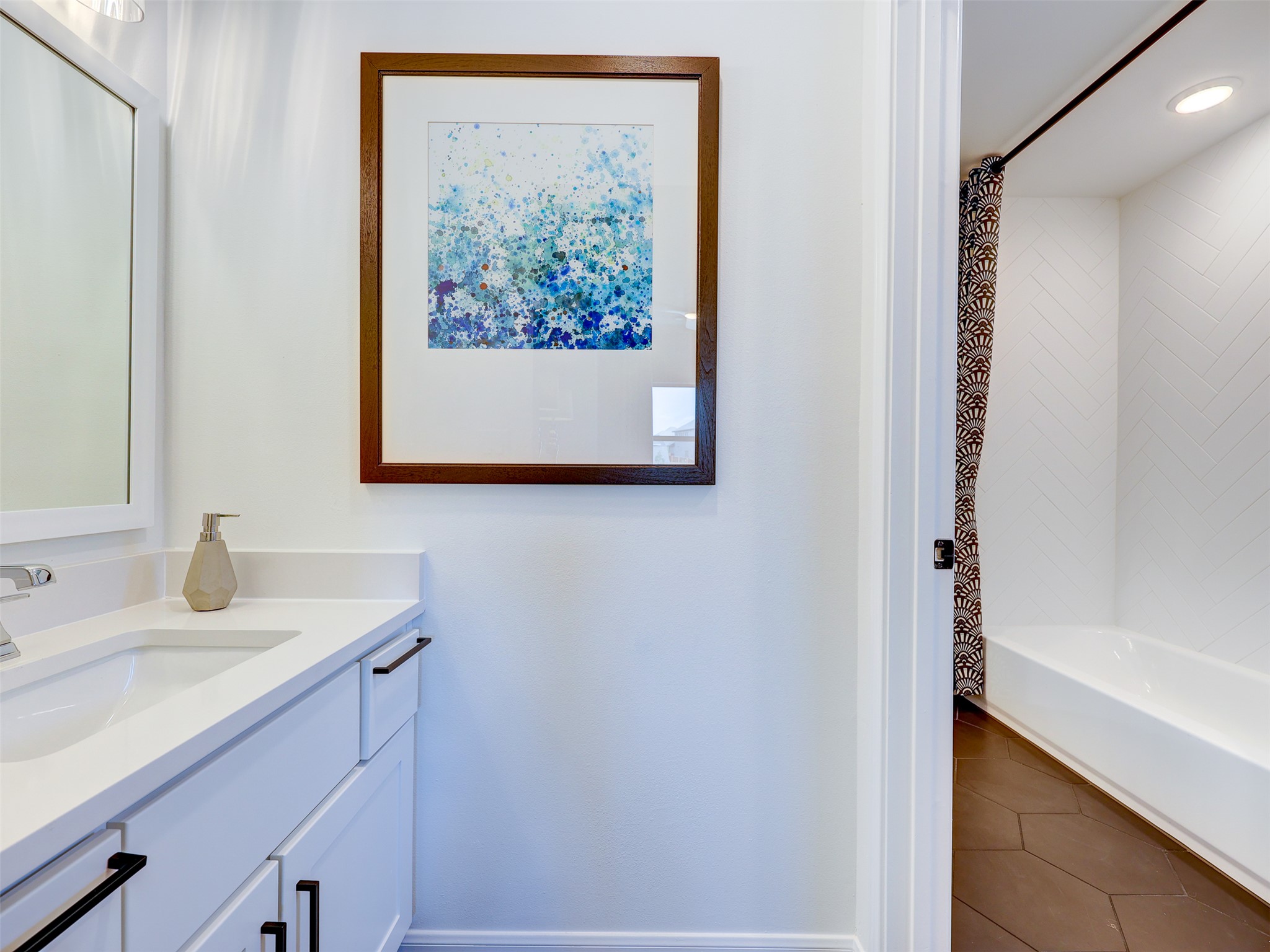 6220 Bower Well Road Austin, TX 78738 - Photo 26 of 28 Bright, contemporary bathroom with a sleek vanity and a private bathing area.