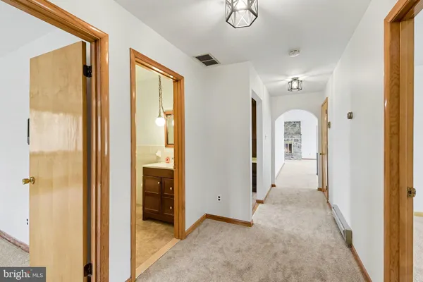 a view of empty room with ceiling fan