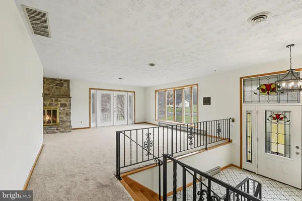 a view of an entryway with wooden floor