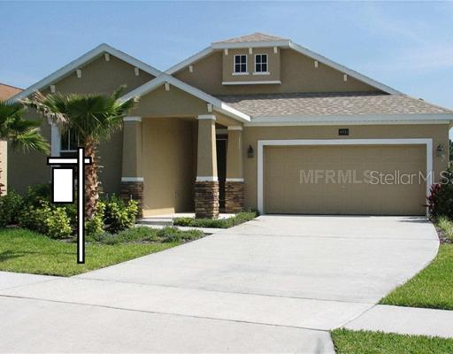 4751 Indian Deer Road Windermere, FL 34786 - Photo 1 of 1 a front view of a house with a yard and garage