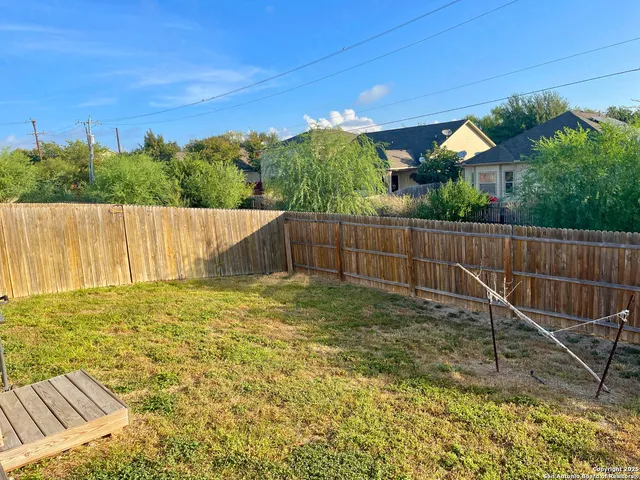 a view of backyard with green space