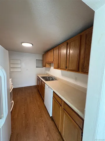 a view of cabinets with wooden floor