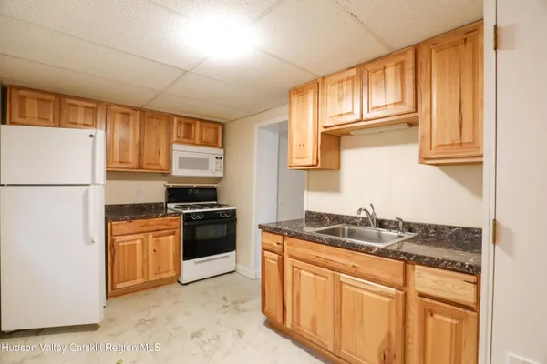 a kitchen with stainless steel appliances granite countertop a stove and a refrigerator