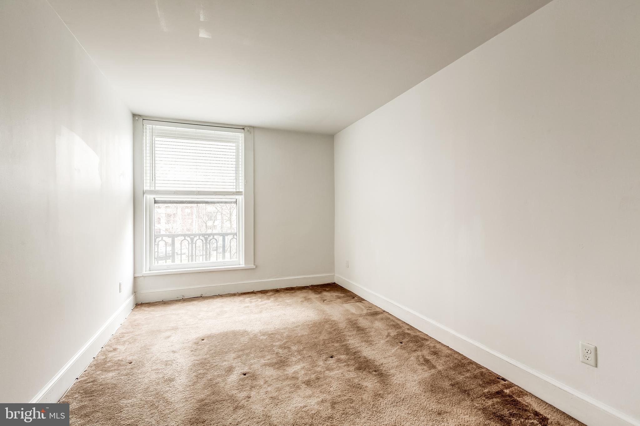 3060 16th Street Northwest, Unit 308 Washington, DC 20009 - Photo 12 of 21 an empty room with a window