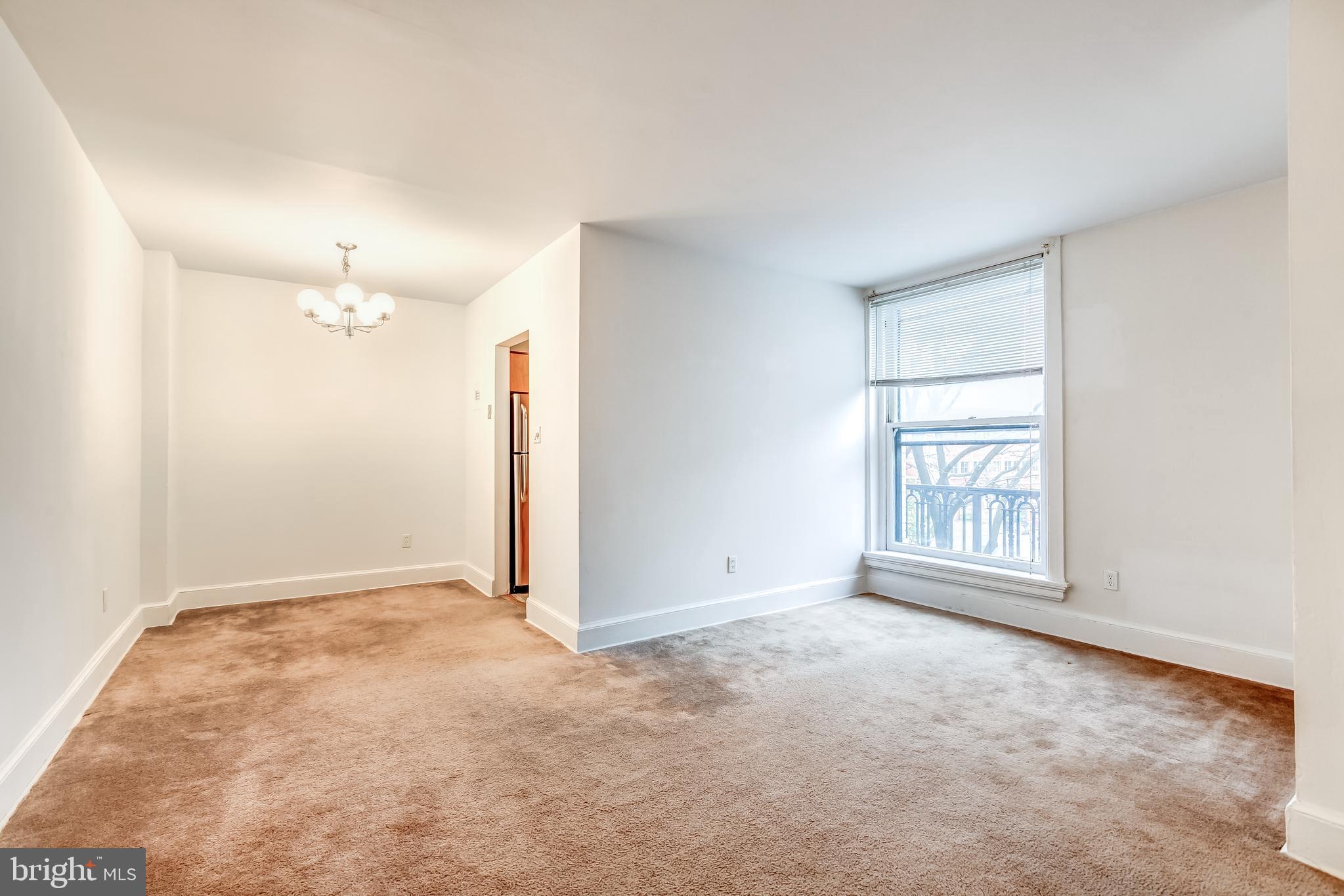 3060 16th Street Northwest, Unit 308 Washington, DC 20009 - Photo 4 of 21 an empty room with windows and closet