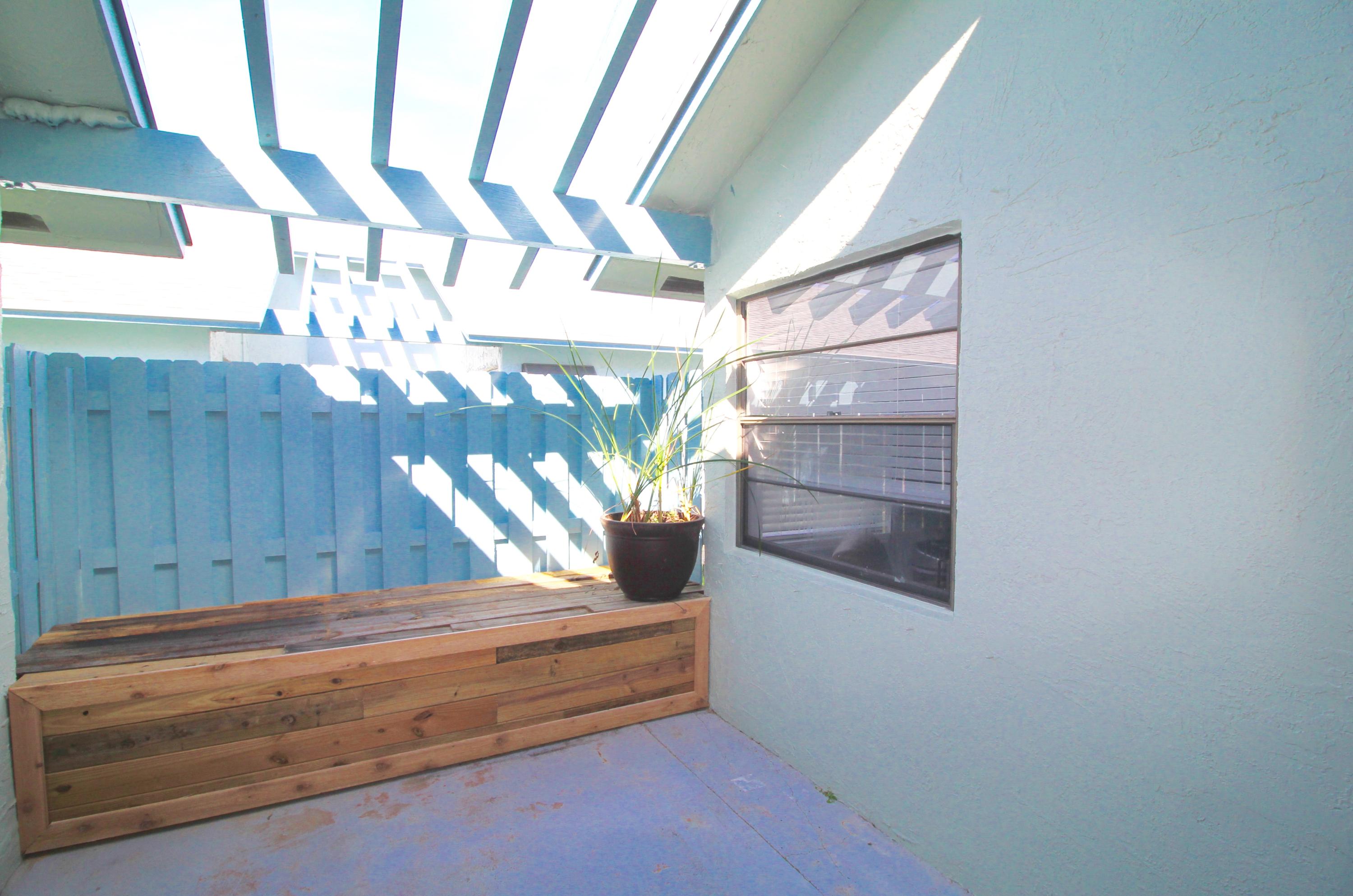 9124 Southwest 22nd Street, Unit F Boca Raton, FL 33428 - Photo 10 of 19 a view of wooden staircase