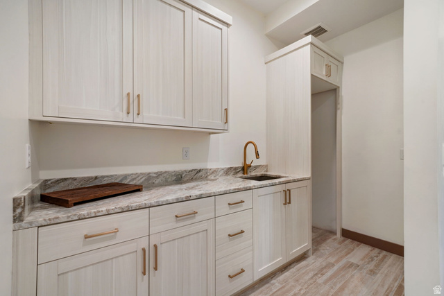 10646 North Reflection Ridge Hideout, UT 84036 - Photo 14 of 43 Cabinetry with a light wood-grain finish and gold-tone hardware