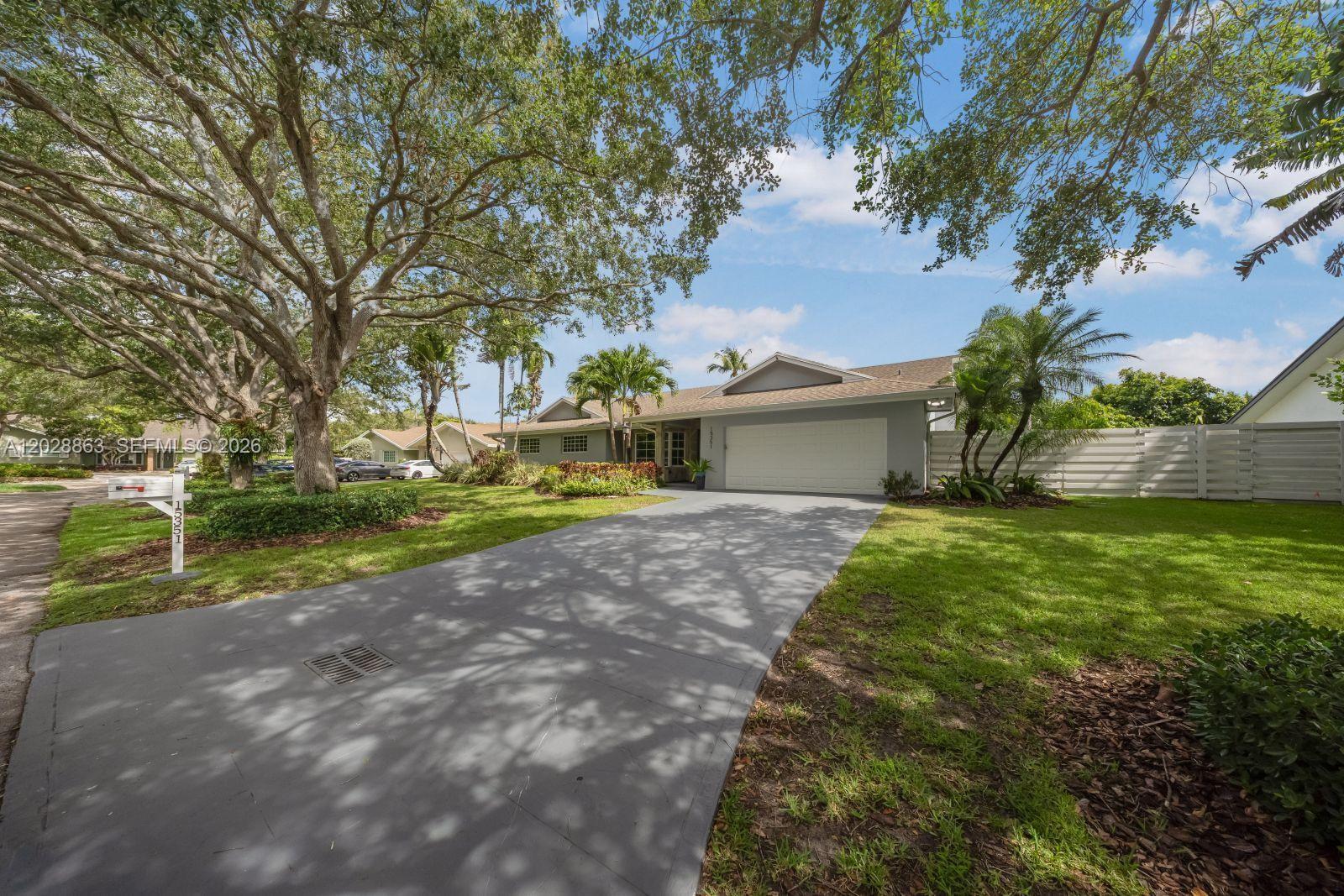 15351 Southwest 146th Street Miami, FL 33196 - Photo 3 of 86 Great curb appeal welcomes you.