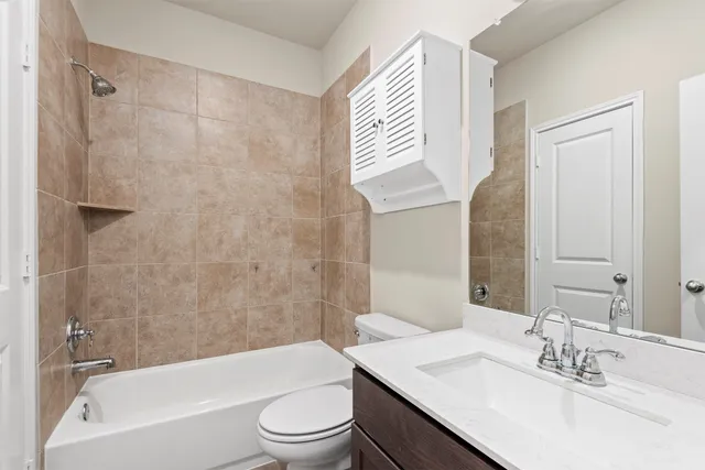 a bathroom with a sink a toilet and a bathtub